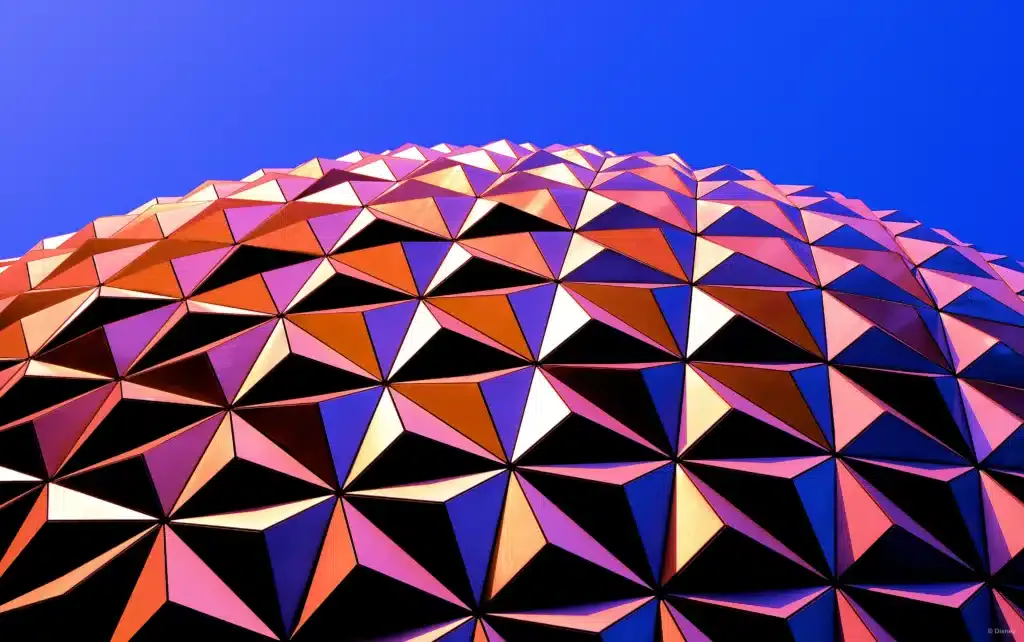 Enjoy the wonders of the Epcot Globe on a budget trip to Epcot using points and cash back apps. 